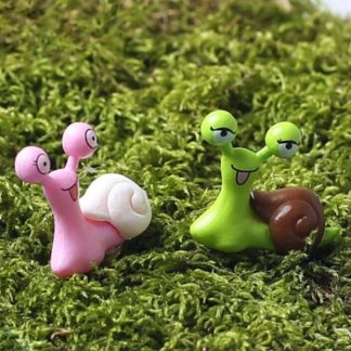 Two cute fairy garden snail figurines for sale